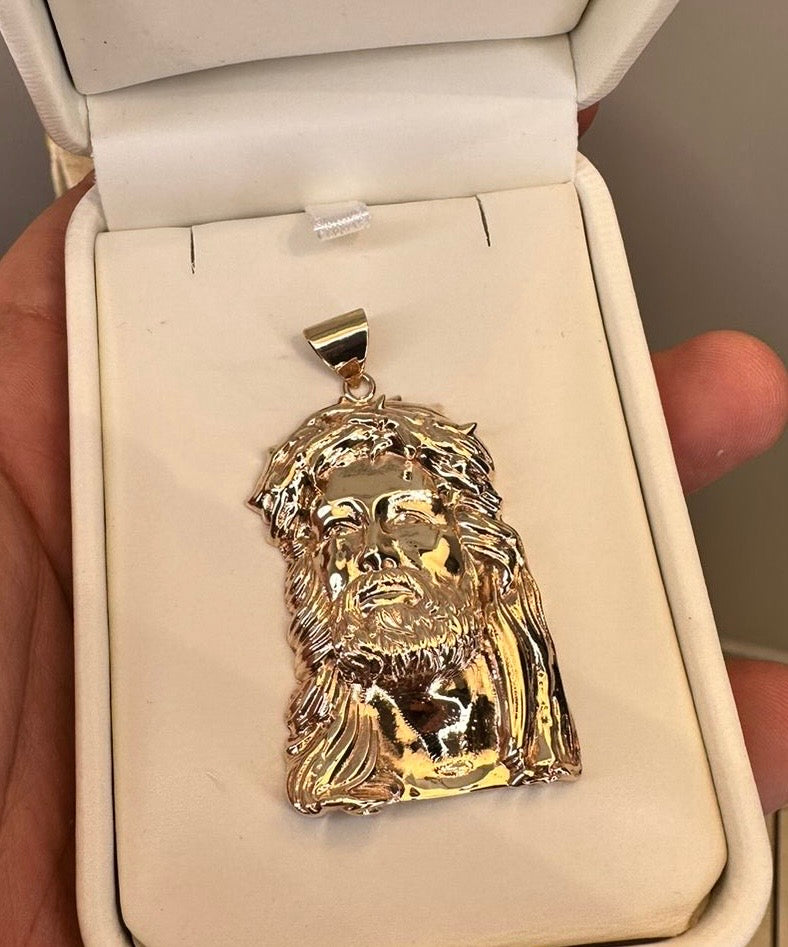 Dije de cabeza de Cristo en oro en su estuche