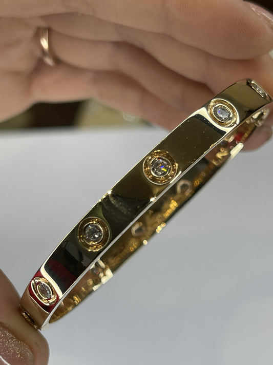 Esclava rígida con zirconias en oro