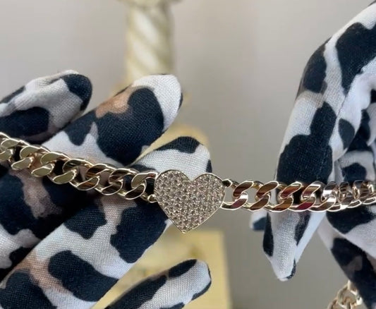 Pulso barbada con corazón de pavé de zirconias en oro