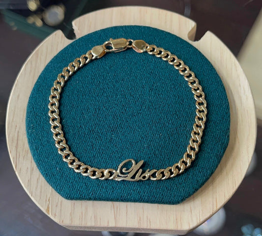 Pulso con inicial L cursiva en oro 18k